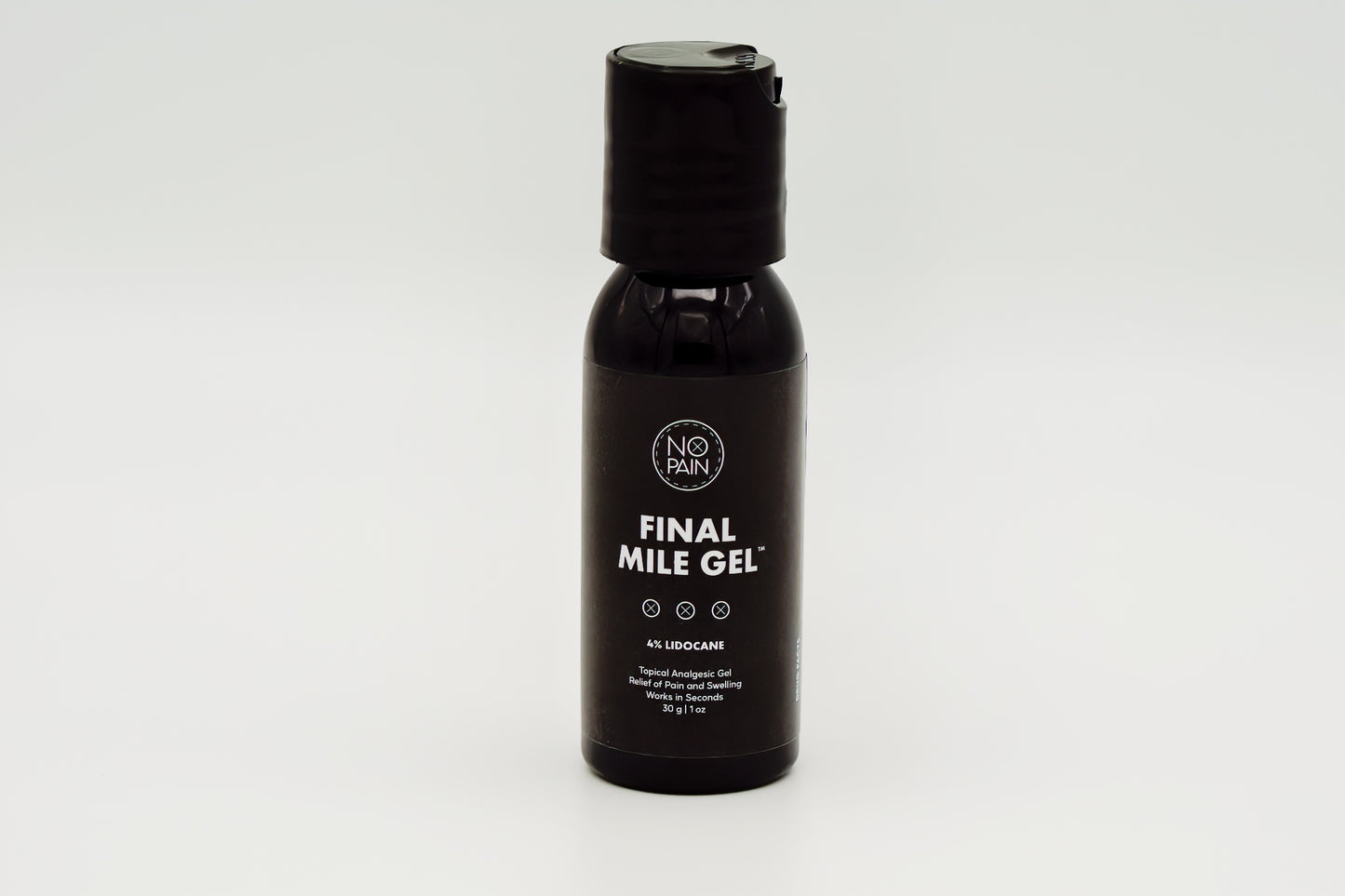 A black bottle of "Final Mile Gel™" with 4% lidocaine by "No Pain Tattoo LLC" is shown. The label highlights its function as a topical analgesic gel for temporary pain relief. Featuring a push-top cap and minimalist design, this product stands out on a clean white background.