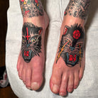 Pair of feet with fresh, vibrant traditional cat tattoos, recently completed using No Pain Tattoo Numbing Cream for a comfortable session.